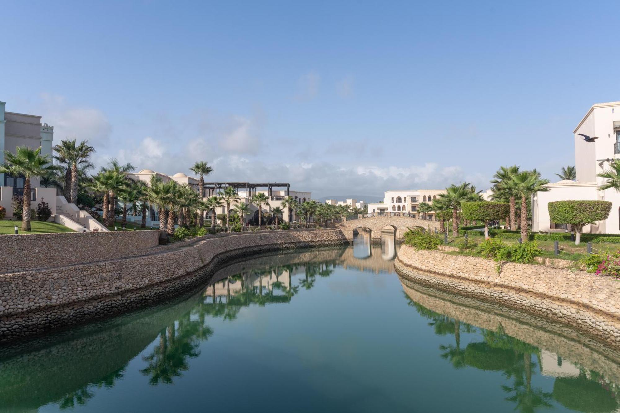 Salalah Rotana Resort Exterior photo Residential canal in Al Reef